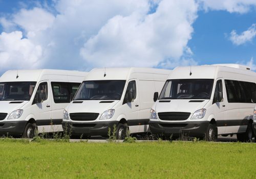40008438 - number of new white minibuses and vans outside